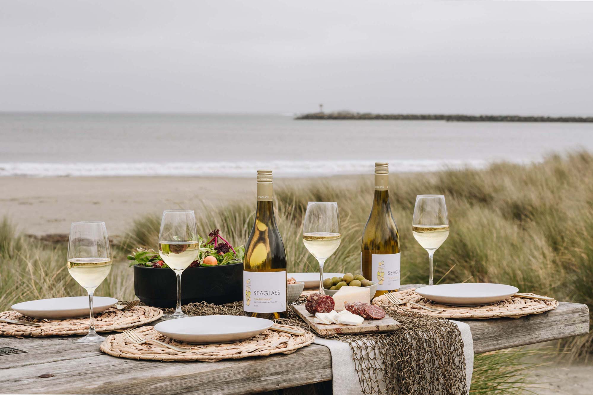 Wine glasses by the sea